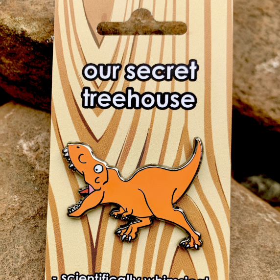 Running T. rex Enamel Pin on printed cardstock