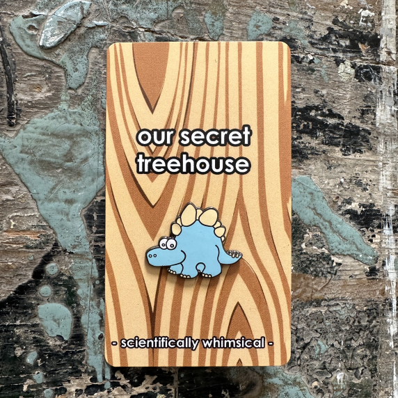 Stegosaurus Enamel Pin on printed cardstock