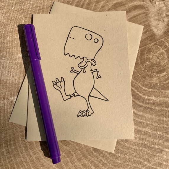 Zombie T. rex card on kraft cardstock, blank inside