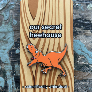 Running T. rex Enamel Pin on printed cardstock